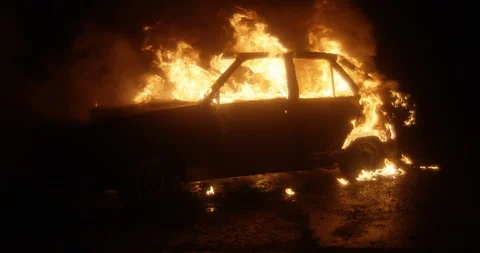 Car burning at night. Slow motion. Stock Footage 130121916