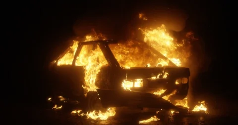 Car burning at night. Slow motion. Stock Footage 130122145