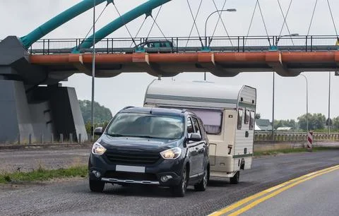 Car with a camping trailer Stock Photos
