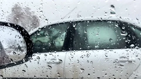 Car from the car window through the falling raindrops bad weather 库存影片 168072708