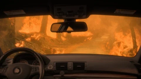 A car is caught in a wildfire Stock Footage 123046238