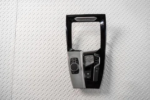 Car center console trim panel isolated on white background Stock Photos