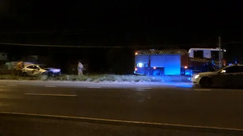 Car on centre highway divider - Ferntree Gully Rd Stock Footage 124628499
