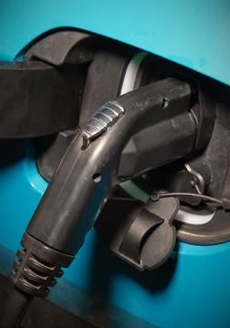 Car charging electric vehicle plug fuel environmental conservation alternativ Stock Photos