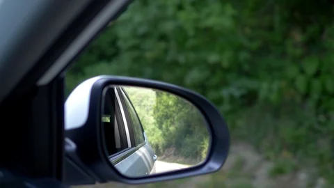 Car chase concept. view from the car window. in the rearview mirror is visible Stock-Footage 111144956