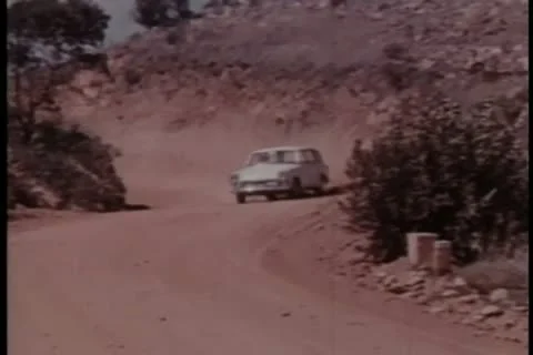 Car chase on dirt road Stock Footage 11350436