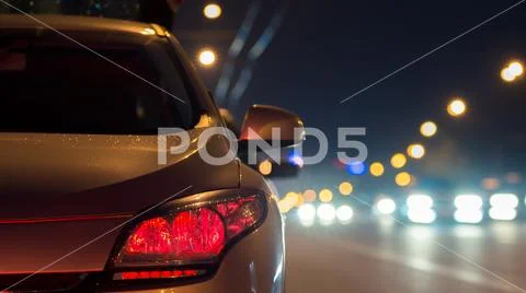 The car on the city highway. Evening night time Stock Photos