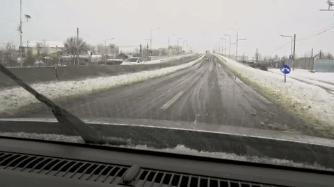 Car on city winter road Видео 87644334