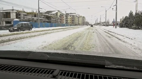 Car on city winter road Видео 87644461