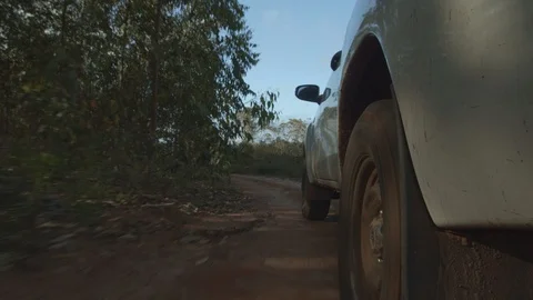 Car on a clay road 2 Stock Footage 127544423