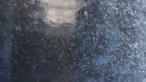 Car cleaning at an automatic car wash. A jet of water hits the windshield Stock Footage 156056861