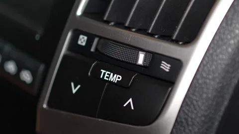 Car climate control panel buttons for temperature adjustment (TEMP) with up a Stock Footage 344596892