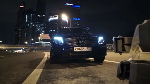 The car comes into focus due to a bump stop on the road. Stock Footage 150106712