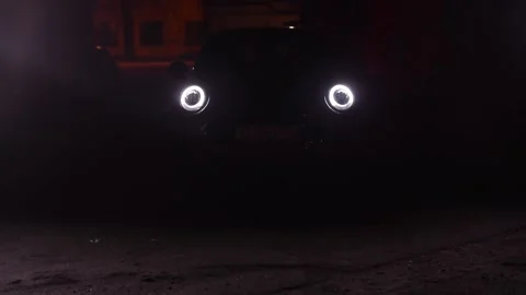The car comes out of the dark. Mini John Cooper Works Stock Footage 211085252