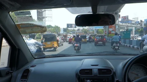 Car comes to a stop as it approaches a traffic signal India Stock Footage 87506527