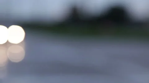 Car coming into focus on a road Stock Footage 49563975