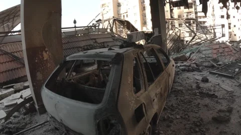 A car completely burned out as a result of the Israeli shelling on the south Video stock 289846520