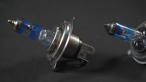 Car component, halogen bulbs, panning on black background Stock Footage 161045121