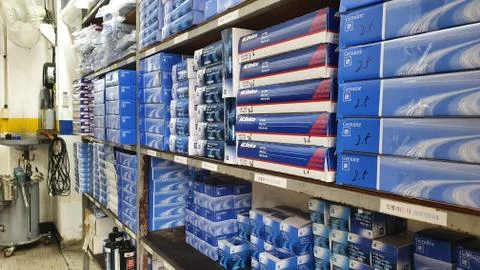 Car components boxes inside of a repair shop in Korea. Fixing cars tools. Stock Photos