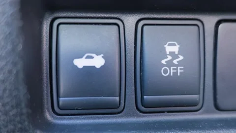 Car console buttons for trunk release and traction control off Video stock 338026415
