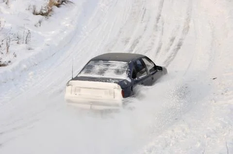 Car cornering spray snow Stock Photos