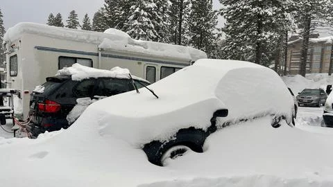 Car covered in deep snow after being left in a parking lot, Mammoth Mountain Stock Photos