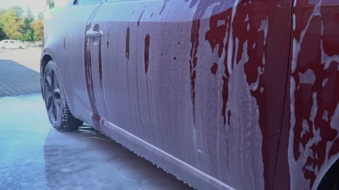 Car covered with foam. Stock Footage 93698700