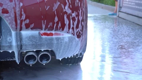 Car covered with foam. Stock Footage 93698725