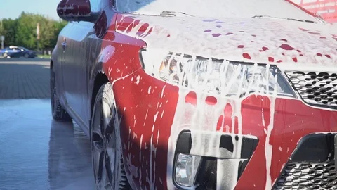 Car covered with foam. Stock Footage 93709502