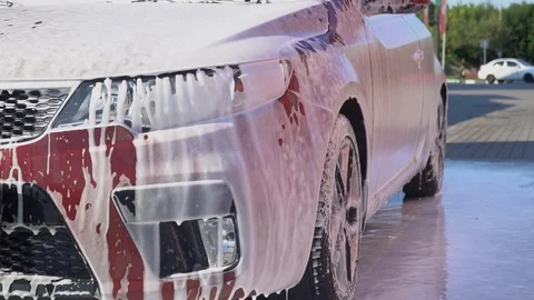 Car covered with foam. Stock Footage 93870786