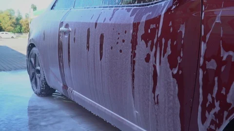 Car covered with foam. Stock Footage 93870825