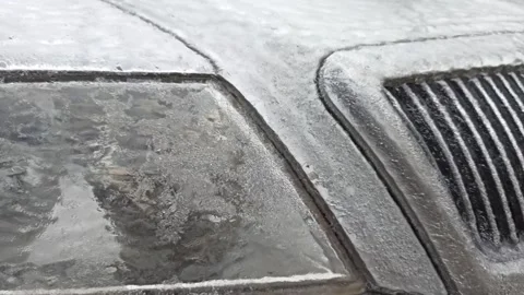 Car covered with a layer of ice in the parking lot Stock Footage 226796175