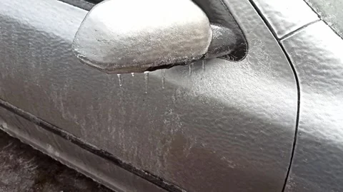 Car covered with a layer of ice in the parking lot Stock Footage 226796367