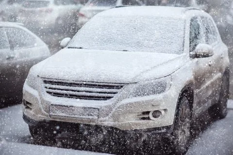 Car covered with a light layer of snow Stock Photos