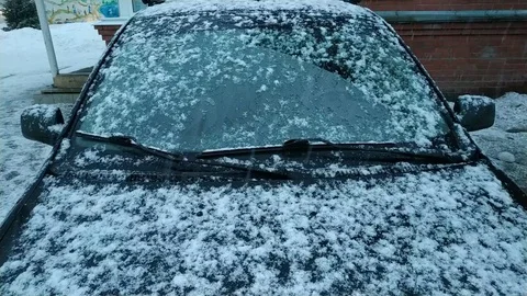 Car covered in snow Stock Footage