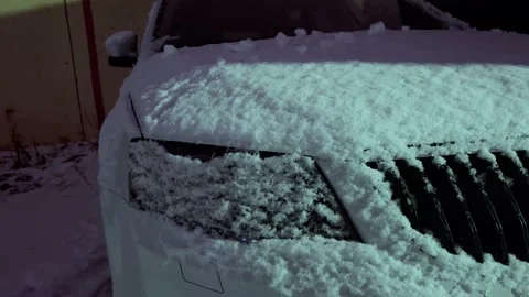 The car is covered with snow Stock Footage 166474898