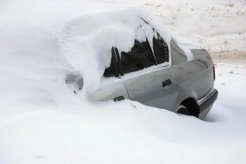 Car covered with snow Stock Photos