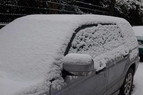 Car covered by snow Stock Photos