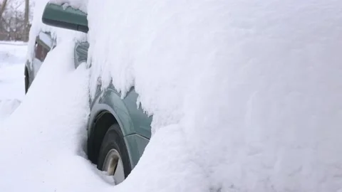 Car covered by snow, under severe winter storm. Cars in the yard under the snow. Stock Footage 101846573