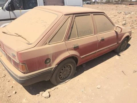 Car covered under the sand Stock Photos