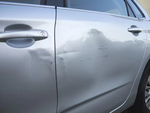 Car crashed with dented door Stock Photos