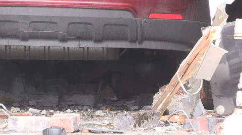 Car crashed into front window of house after road accident Stock Footage 59789432