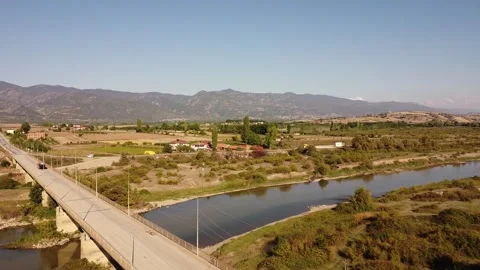 Car Crossing Bridge over Stream on Mountain Road – 4K Aerial Drone Footage Stock Footage 319689902