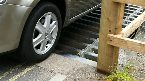 Car Crossing a Cattle Grid Stock Footage 244743717