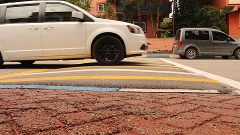 Car crossing speed bump for safe driving traffic calming road and vehicle safety Stock Footage 317364826
