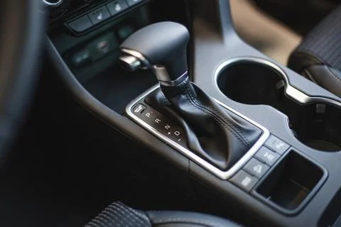 Car cup holders between back seats, close up view, luxury car interior Stock Photos