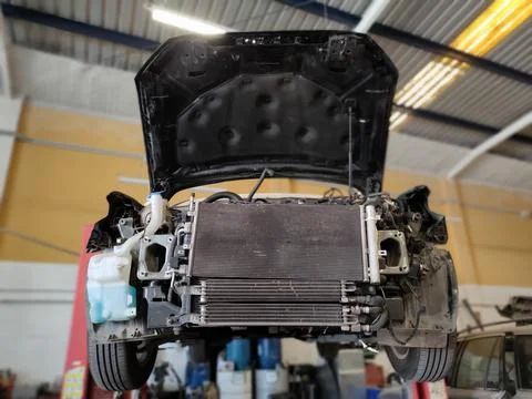 Car damaged in elevator in machine shop Stock Photos