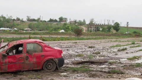 Car damaged by the flood caused by Storm Boris in Galati, Cudalbi, Romania Stock Footage 284877708