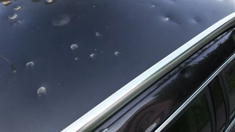 Car damaged by hail Stock Footage 311542641