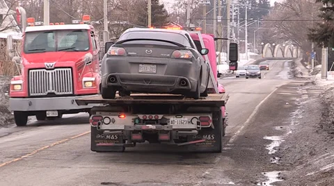 Car damaging large potholes on city streets Stock Footage 35948866